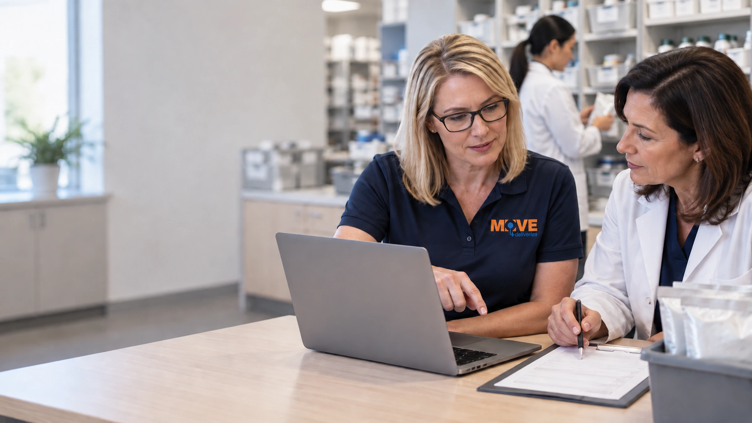 Workflow specialist and pharmacy manager planning delivery integration together